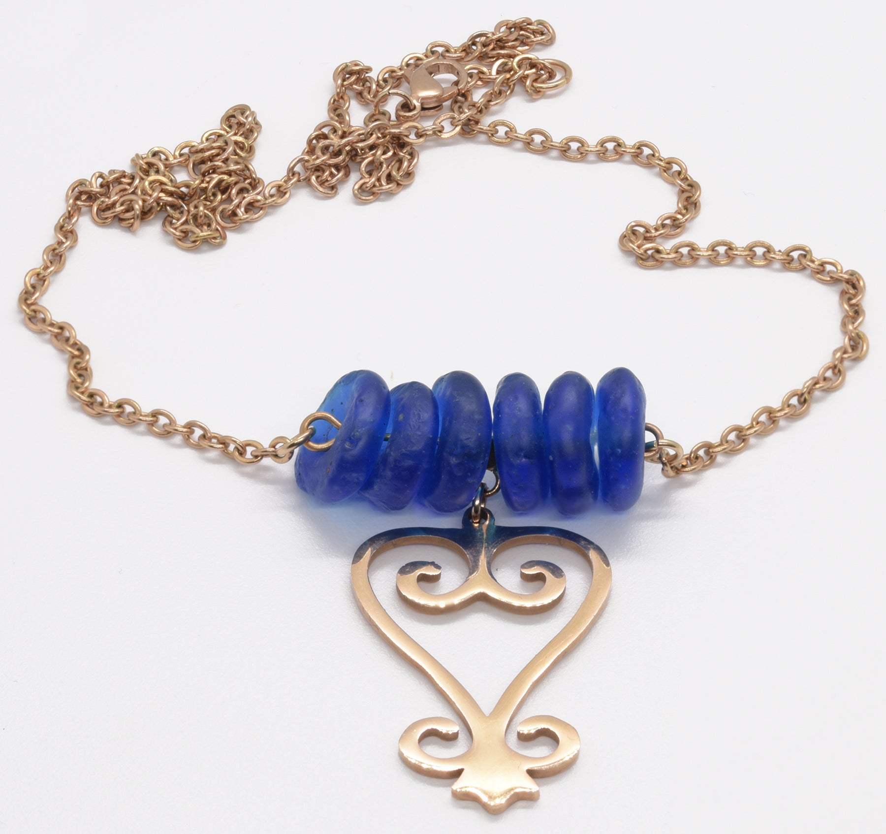Handmade African Earrings & Adinkra Sankofa Pendant With Cobalt Blue Beads - angled shot